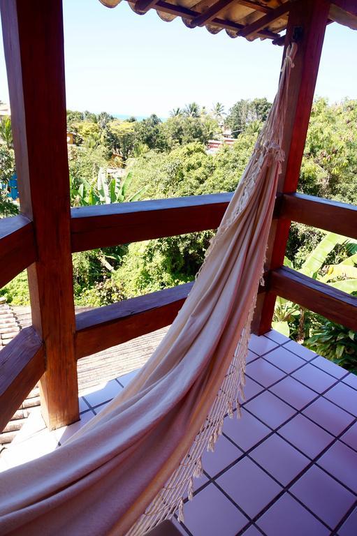 Novos Baianos Hostel E Pousada Porto Seguro Ngoại thất bức ảnh A hammock hanging from a balcony